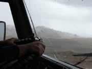 steering wheel of Kamaz, hands of Uncle Zhenya, foothils of Pamirs